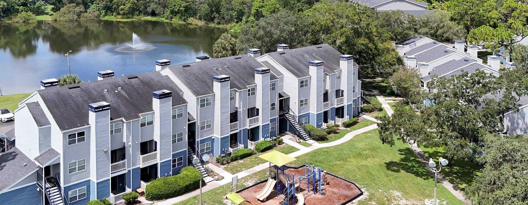 a building with a pond in the front
